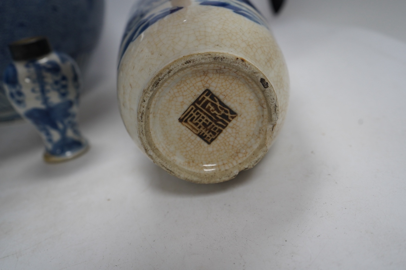 Four Chinese blue and white vases, a jar and cover and a tea bowl, Kangxi to 20th century, tallest vase 38cm high. Condition - poor